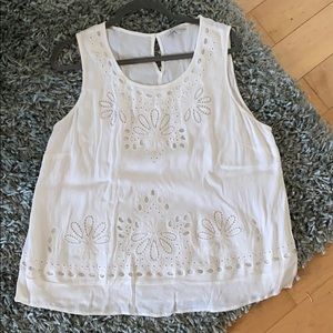 White eyelet sleeveless top.